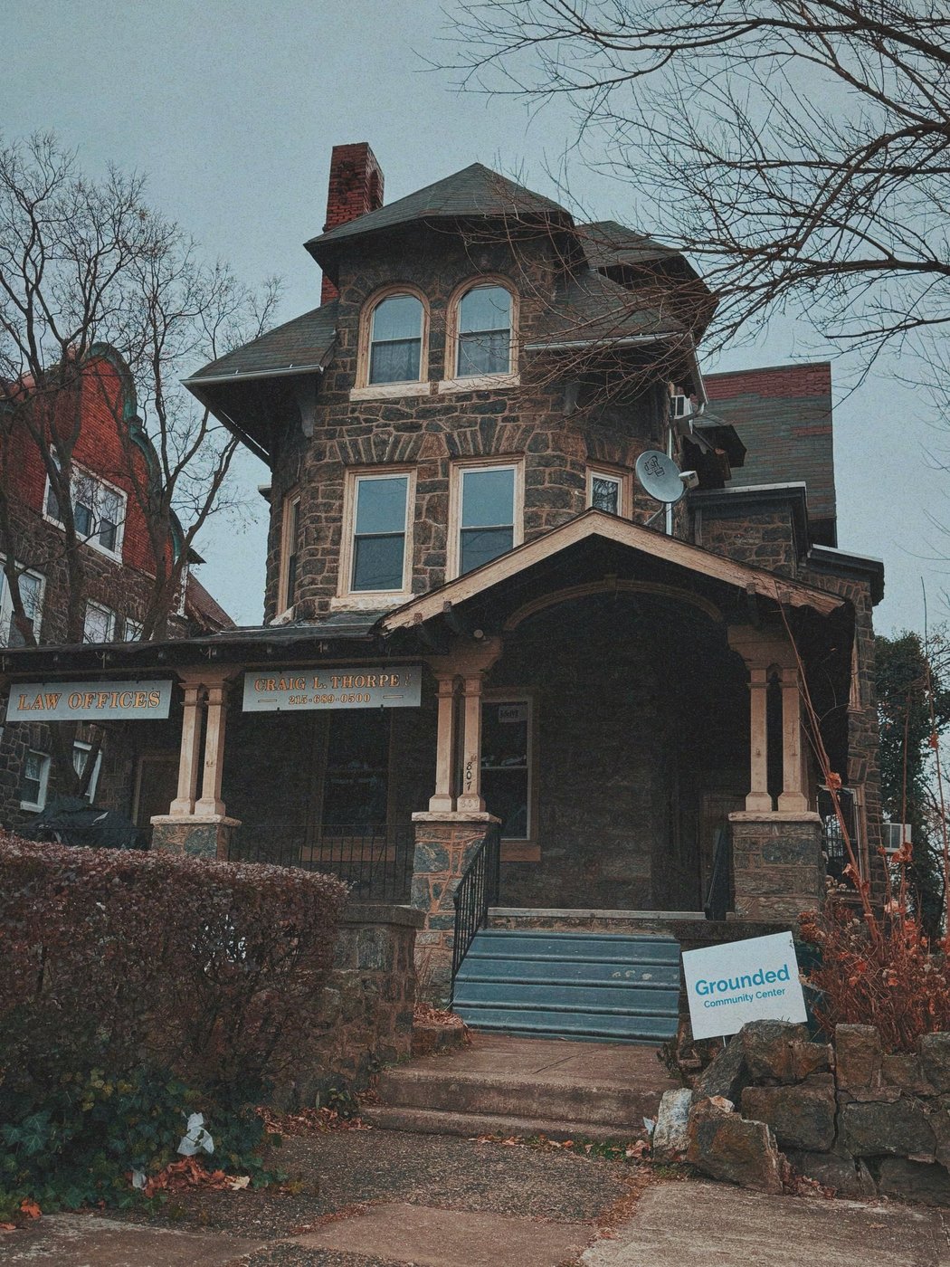 The Grounded Community Center at 807 N 63rd Street, Philadelphia: a three-story stone building with the Grounded Community Center sign visible at the entrance